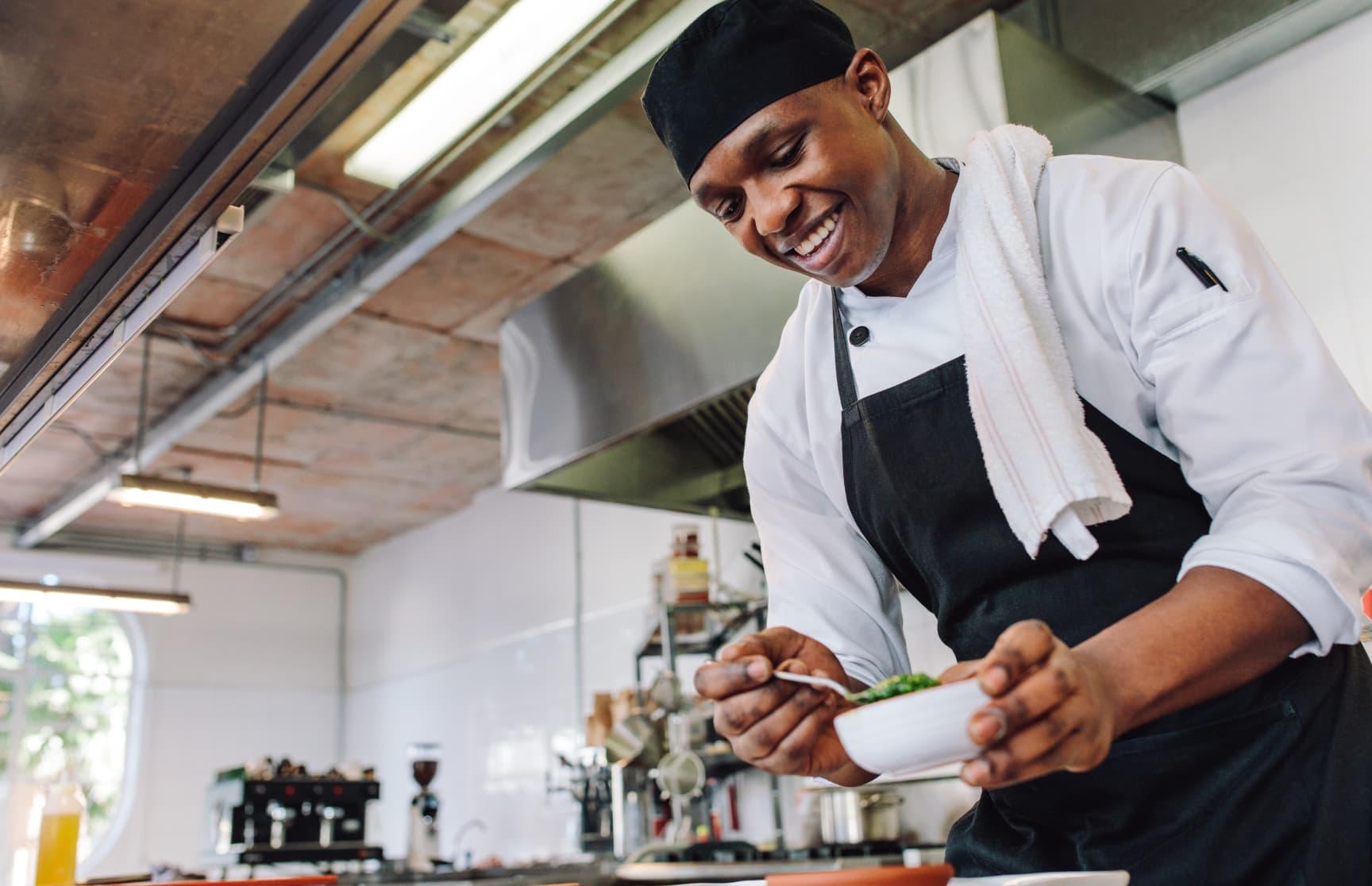 a happy cook prepares a meal